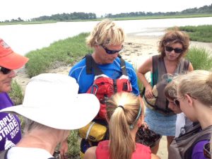 Todd showing curious paddlers how horseshoe crabs eat.