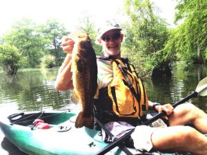 Jim's fishing PFD has attachments for all of his gear. The fish tremble in fear when they see him coming!